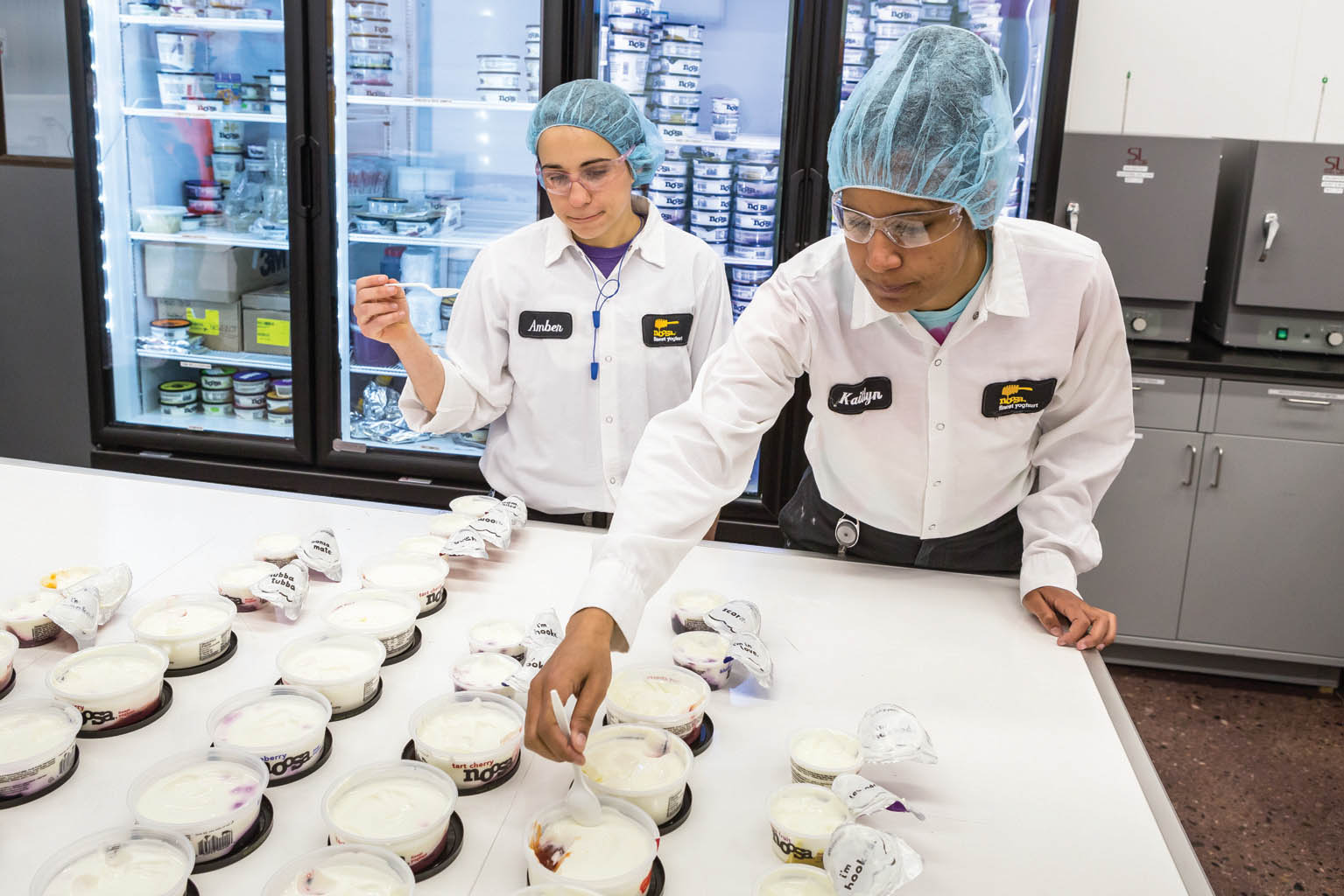 Lab technicians perform sensory evaluations of yogurts pulled from the production line.