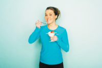 Woman eating a dairy treat