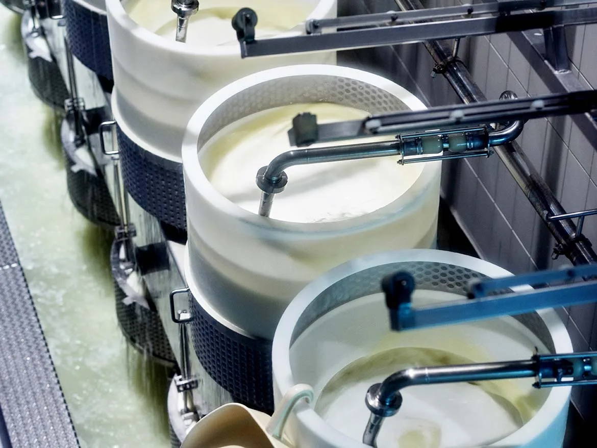Reducing cream cheese process waste via sanitary process control and inline recovery logic