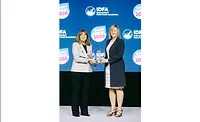 Karen McCarty, right, accepts IDFA’s 2026 Food Safety Leadership Award from Roberta Wagner, IDFA’s senior vice president of regulatory and scientific affairs, during the Dairy Forum. 