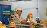 Darigold pulls the first few products off the filler line to perform a quality check.