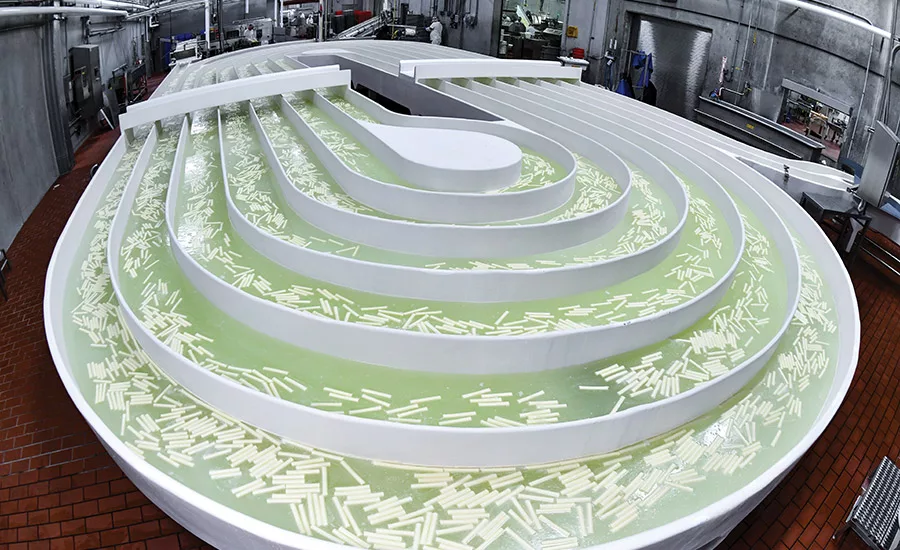Cheese sticks travel through a lazy river of brine for 10 minutes before entering the packaging department.