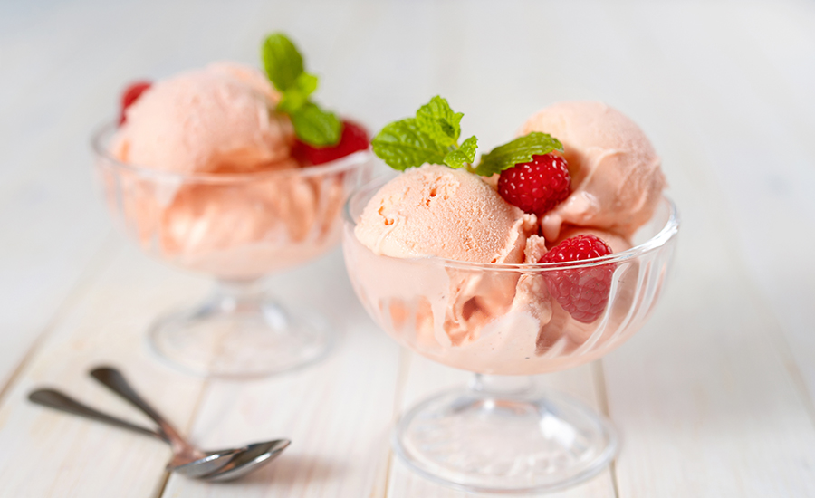 Studio shot of raspberry ice cream in glass dishes