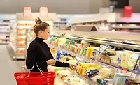 woman shopping at a grocery store woman shopping at a grocery store