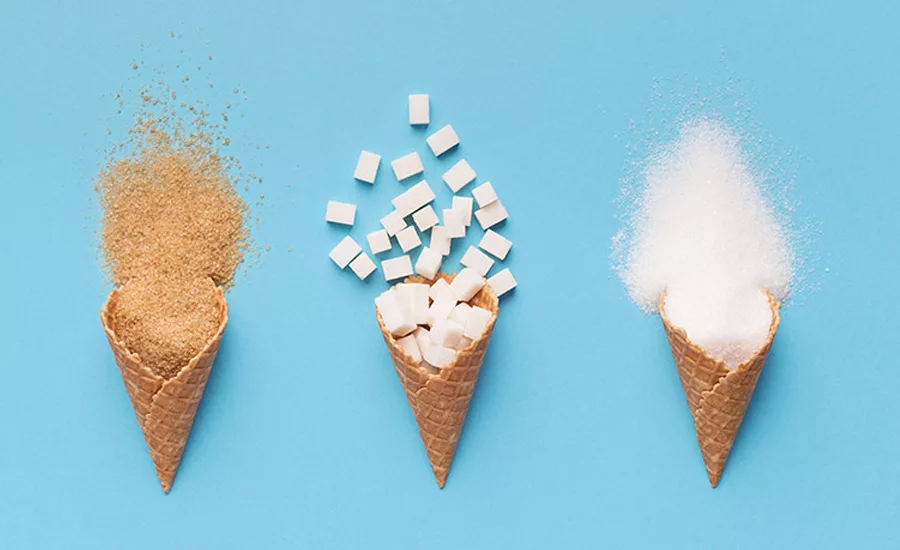 ice cream cones filled with brown sugar, white sugar and cubed sugar