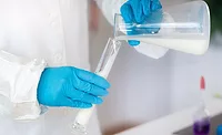 pouring milk into a flask pouring milk into a flask
