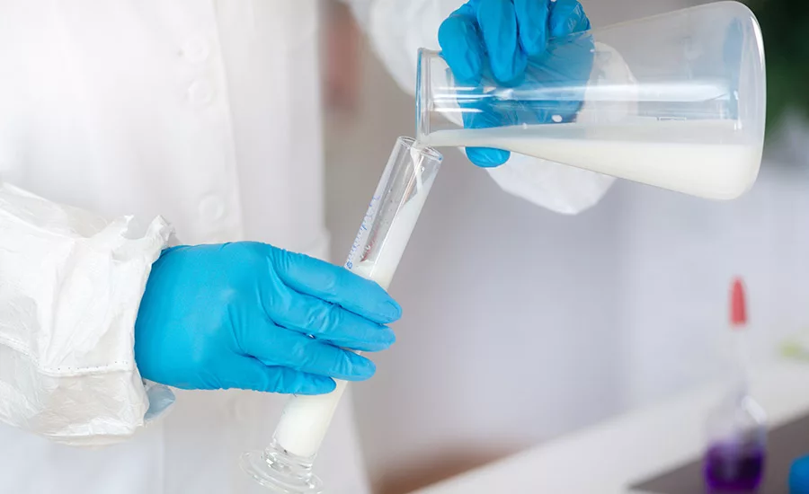 pouring milk into a flask
