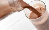 pouring chocolate milk into cup pouring chocolate milk into cup