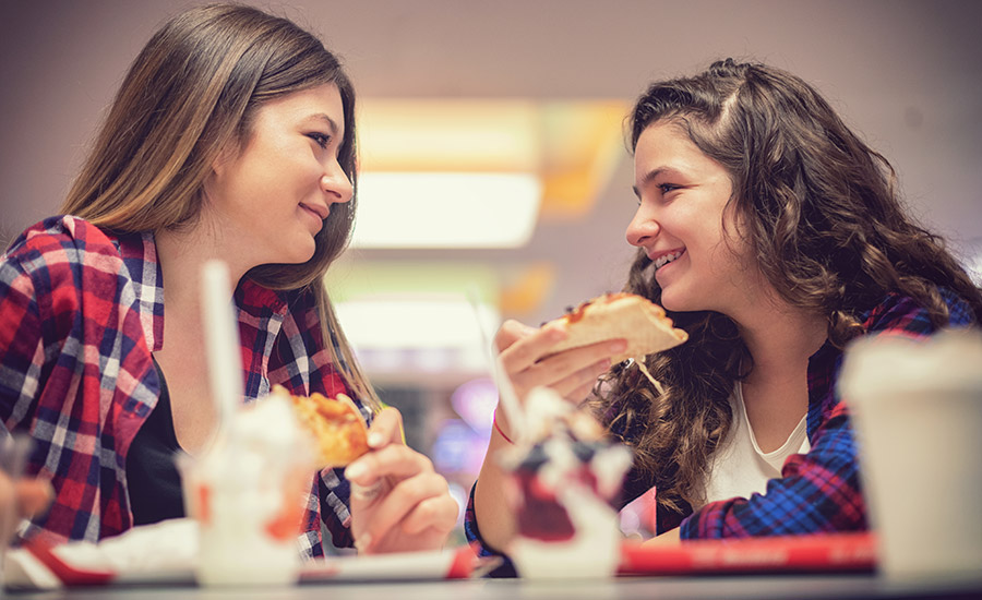current image of two girls eating