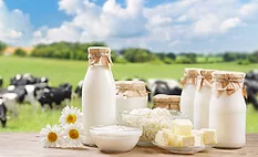 dairy products with cows in the background