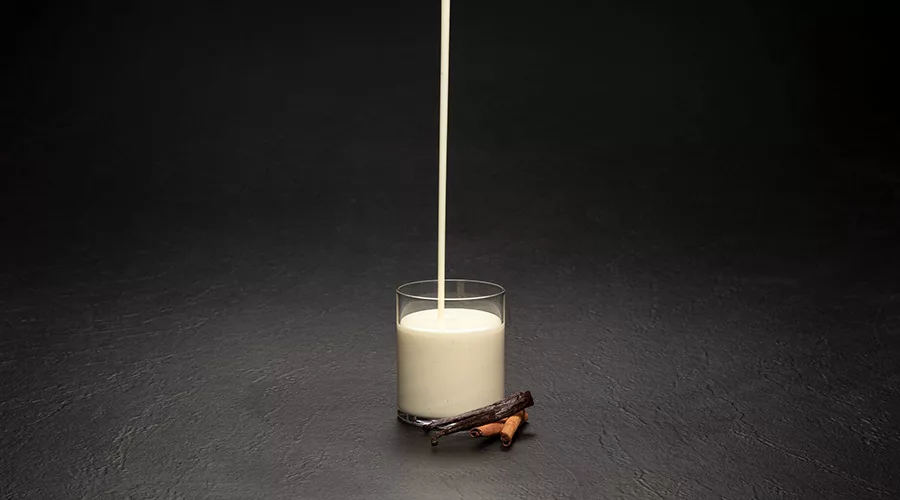 pouring milk in a glass