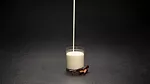 pouring milk in a glass