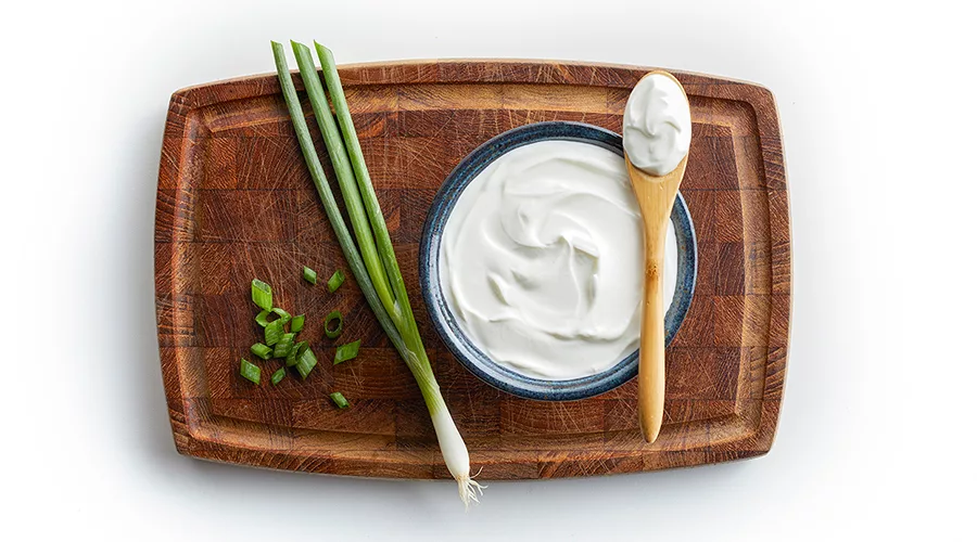 a container of Emborg Sour Cream