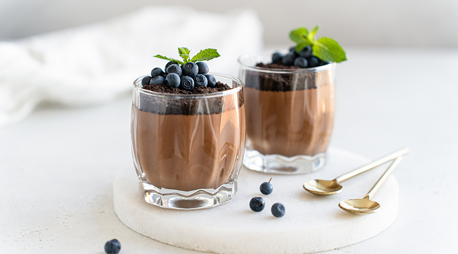 two glasses of chocolate mousse, a classic French dessert.