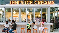 Customers outside Jeni's Ice Creams store Customers sitting on orang bar stools outside of Jeni's ice cream store eating ice cream.