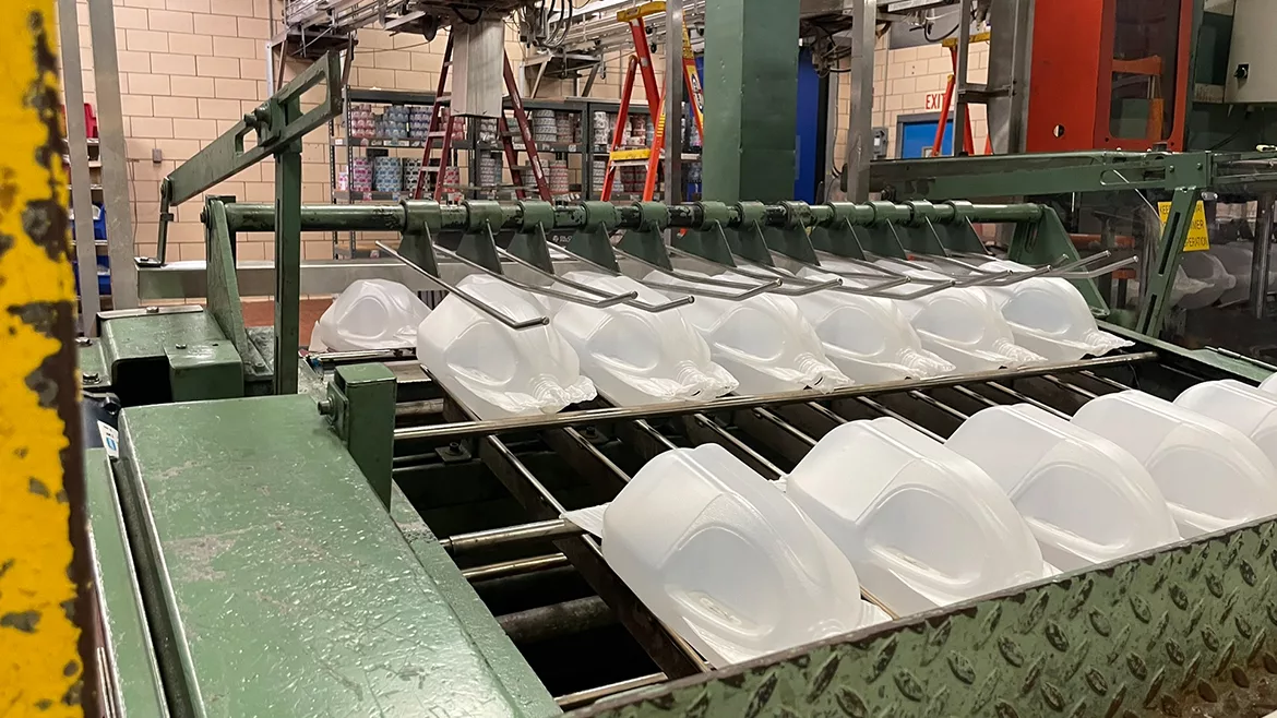 Rows of gallon jugs being produced in-house at Maola.