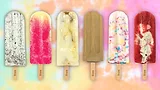 A row of Frios Gourmet Pops with a tie dye pattern as a background.