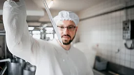 The technologist examines the quality of milk, test tubes.
