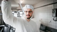 The technologist examines the quality of milk, test tubes.