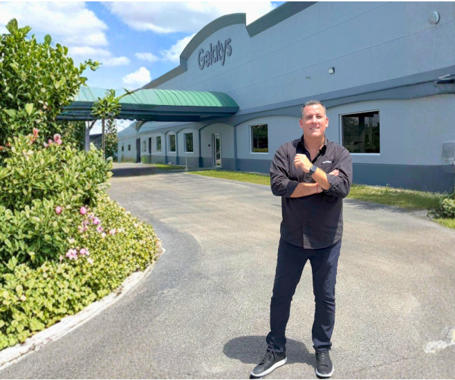 Adolfo Heller Cohen, founder and CEO of Gelatys is posing in front of the new 30,000-plus square-foot production facility in Fort Myers, Florida